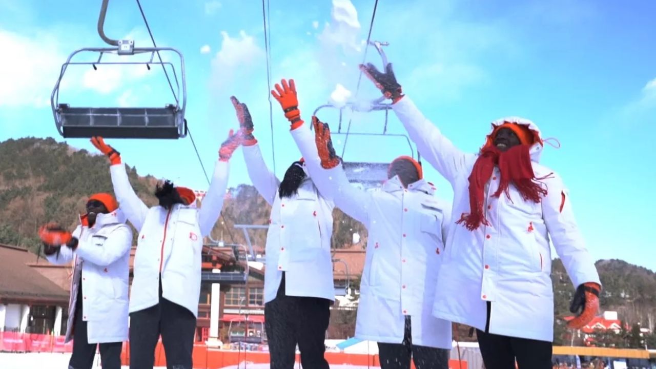 The team experience snow for the first time.