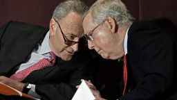 Senate Minority Leader Charles Schumer, D-N.Y., left, leans in to speak to Senate Majority Leader Mitch McConnell, R-Ky., before his speech at the McConnell Center's Distinguished Speaker Series Monday, Feb. 12, 2018, in Louisville, Ky. (AP/Timothy D. Easley)
