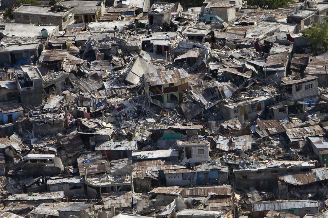 Houses in a poor neighborhood sit destroyed after an earthquake on January 13, 2010, in Port-au-Prince, Haiti.