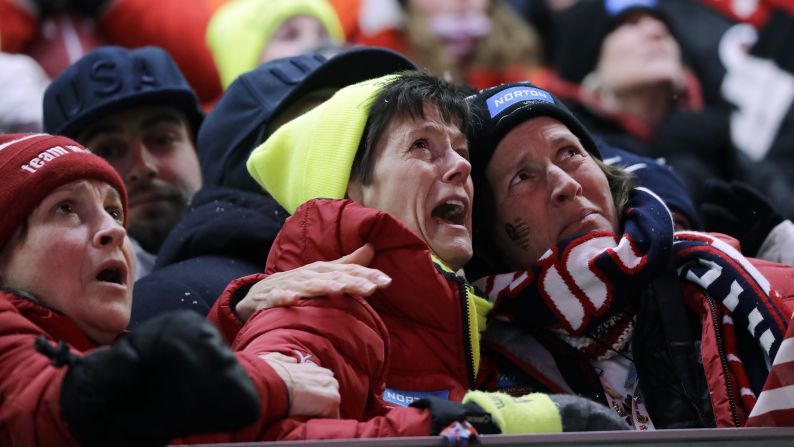 Sue Sweeney, center, reacts to her daughter's crash in the luge.