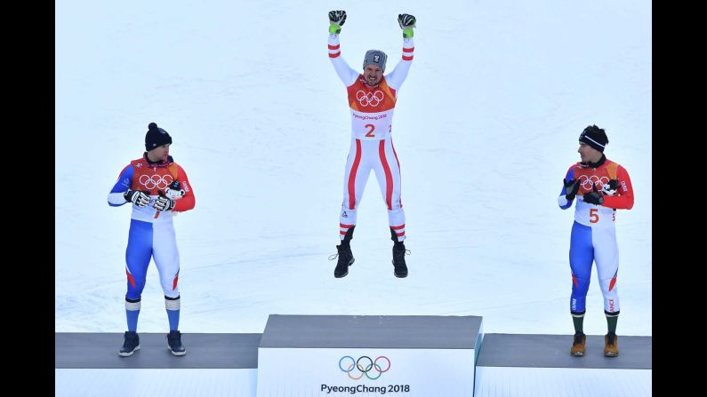 Austrian skier Marcel Hirscher celebrates on the podium after winning his first Olympic gold medal. The six-time world champion held off France's Alexis Pinturault, left, and Victor Muffat-Jeandet in the combined.