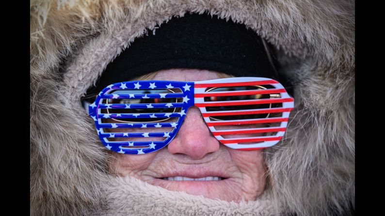 A woman shows her support for the United States during the men's halfpipe qualification.
