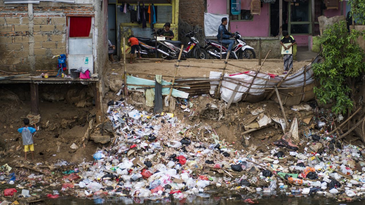 Trash thrown into a riverbank at a slum in Jakarta on January 10, 2018.