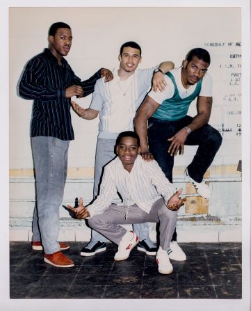 Pretrial detainees, all part of the "House Gang" (sanitation workforce), pose in the day room of their housing area at Rikers Island, 1986.