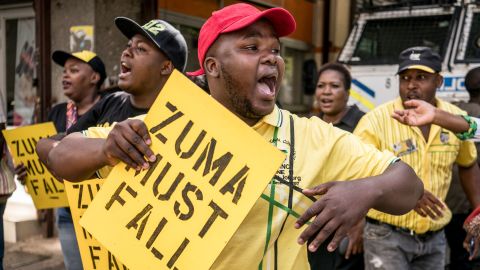 Supporters of ANC leader Cyril Ramaphosa chant slogans outside the party headquarters in Johannesburg on February 5.