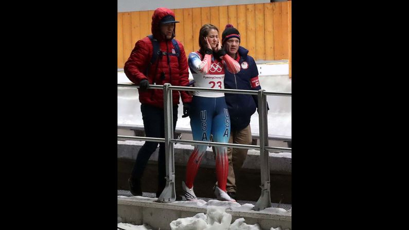 American luger Emily Sweeney walks away after crashing on her final run.