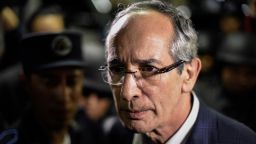 Former Guatemalan President Alvaro Colom is detained on corruption charges in Guatemala City on Tuesday.