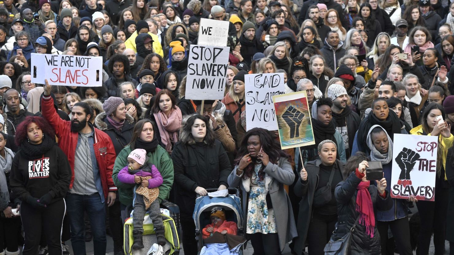 Protestors attend a demonstration against slavery, in Stockholm, Sweden, on November 25, 2017.