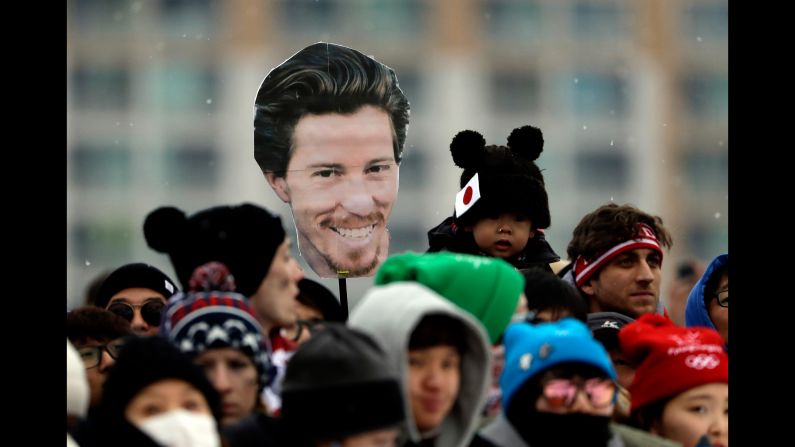 Fans hold an image of Shaun White during the men's halfpipe competition.