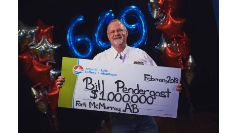 Bill Pendergast was presented with his lottery winnings on Friday.