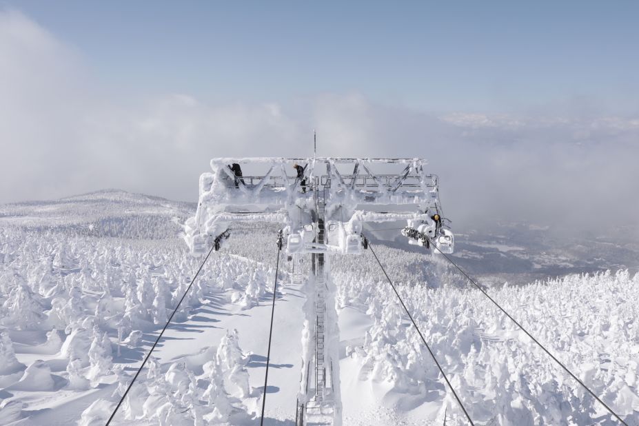 <strong>An unenviable job: </strong>View from the lookout point at the observation center. Men clean snow off the top of the cable car towers.  