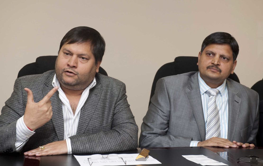 Indian businessmen, Ajay Gupta, right, and younger brother Atul Gupta pictured in March 2011.