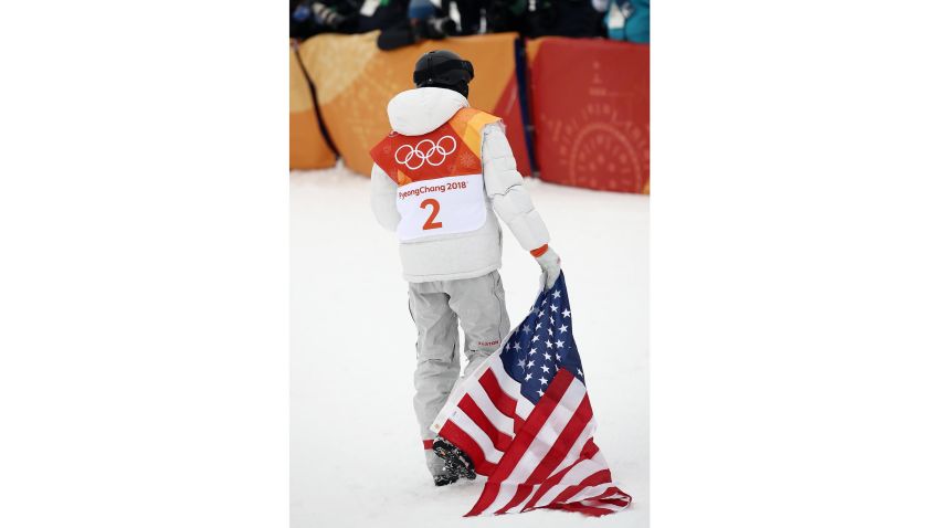 PYEONGCHANG-GUN, SOUTH KOREA - FEBRUARY 14: Gold medalist Shaun White of the United States drags the American flag as he celebrates during the Snowboard Men's Halfpipe Final on day five of the PyeongChang 2018 Winter Olympics at Phoenix Snow Park on February 14, 2018 in Pyeongchang-gun, South Korea. (Photo by Cameron Spencer/Getty Images)