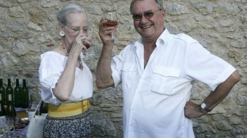 Prince Henrik enjoys a drink with Queen Margrethe at their summer residence in Caix, France, 2006.
