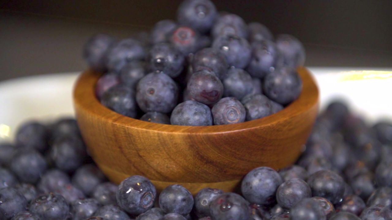 The fiber in cup of berries, such as blueberries, will help fill you up.
