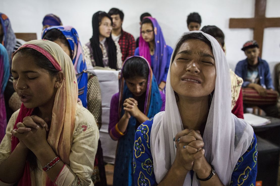 Nepalese Christians pray during a weekly church service in a small village of Tikhatal, in the Dolakha region of Nepal.