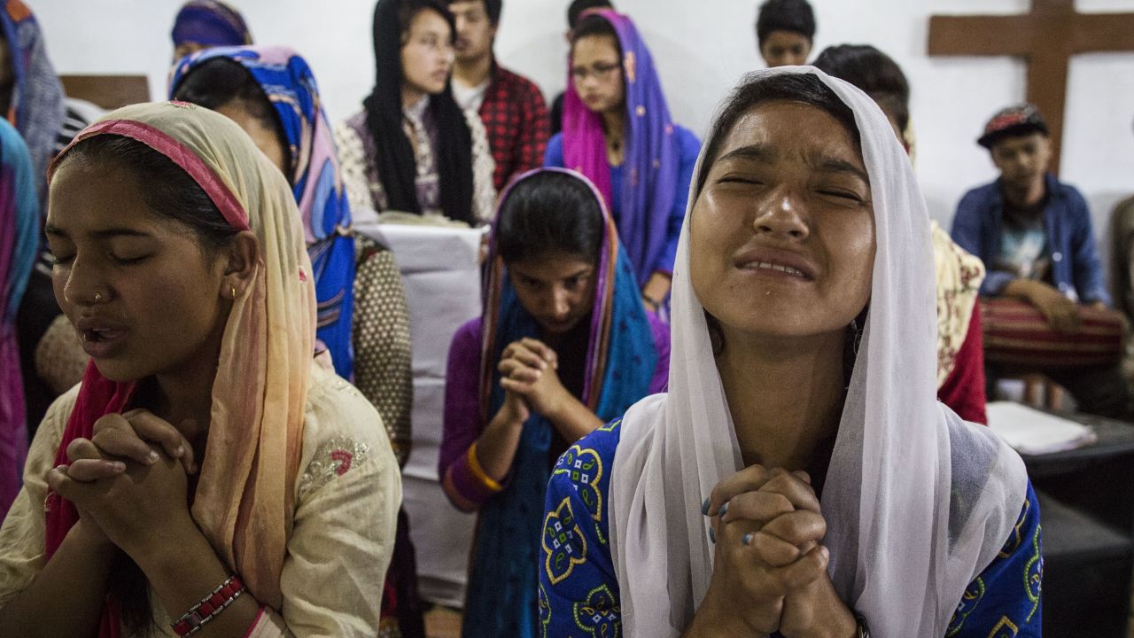 Nepalese Christians pray during a weekly church service in a small village of Tikhatal, in the Dolakha region of Nepal.