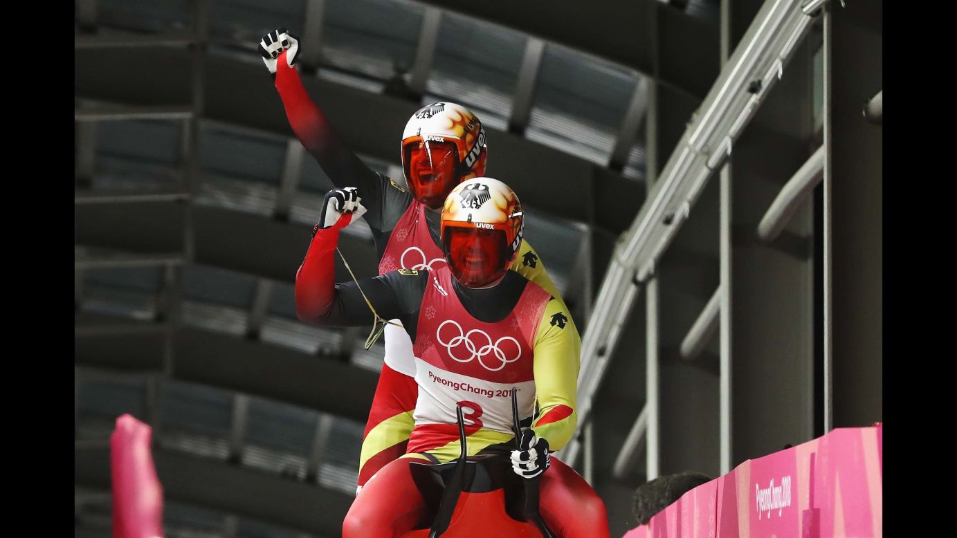 Germans Tobias Wendl and Tobias Arlt celebrate after winning gold in doubles luge. They also won gold in 2014.