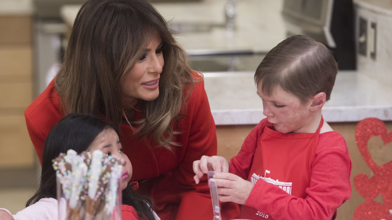 Melania Trump decorates cookies for Valentine's Day as she visits with children who are currently patients at the National Institutes of Health (NIH) at The Children's Inn at NIH in Bethesda, Maryland.