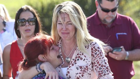 Parents wait for news after reports of the shooting at Marjory Stoneman Douglas High School.