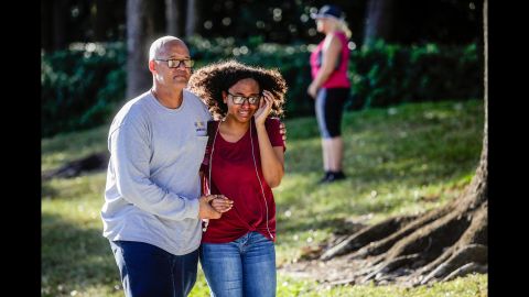 A father and daughter embrace after a mass shooting at the Marjory Stoneman Douglas High School.