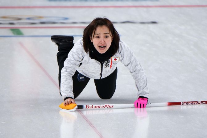 Japan's Satsuki Fujisawa shouts for instructions during a curling match against Denmark.