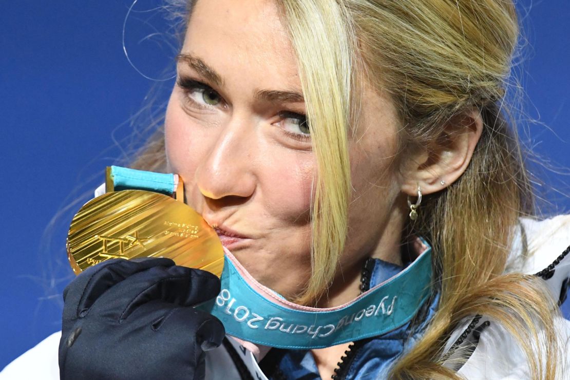 Shiffrin kisses her gold medal on the podium. (Dimitar Dilkoff/AFP/Getty Images)