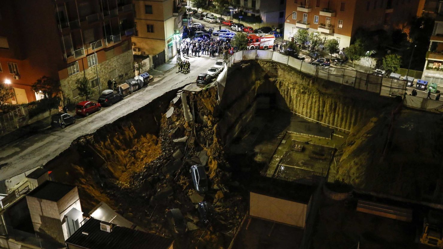 A view of a large sinkhole that opened in a street of a residential area in Rome on Wednesday.