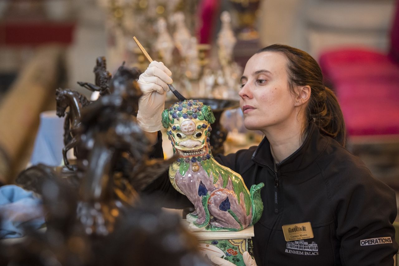Every winter, Blenheim Palace staff undertake a 'deep clean' that takes six weeks. A valuable Chinese ornament is being carefully cleaned with a special, natural bristle brush. 