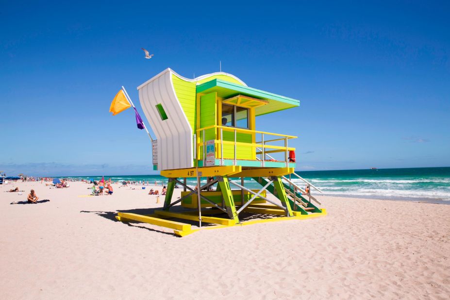 Early birds catch the best beach chairs in Miami Beach, not to mention a peaceful oceanfront scene for a swim or yoga session.