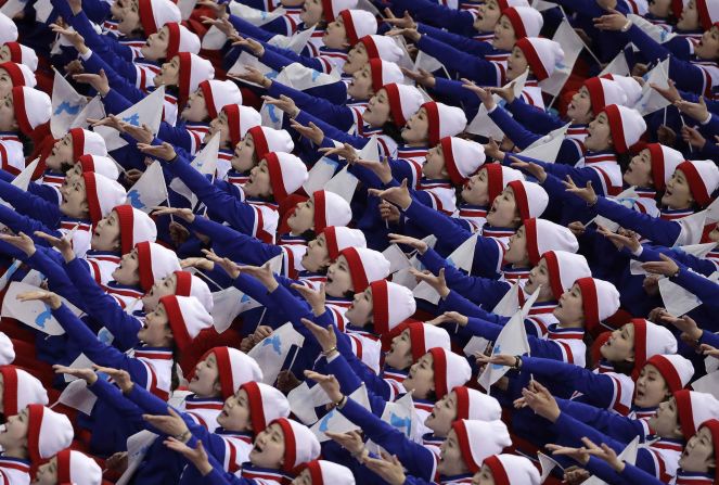 North Korean supporters cheer before a men's hockey game between South Korea and the Czech Republic.