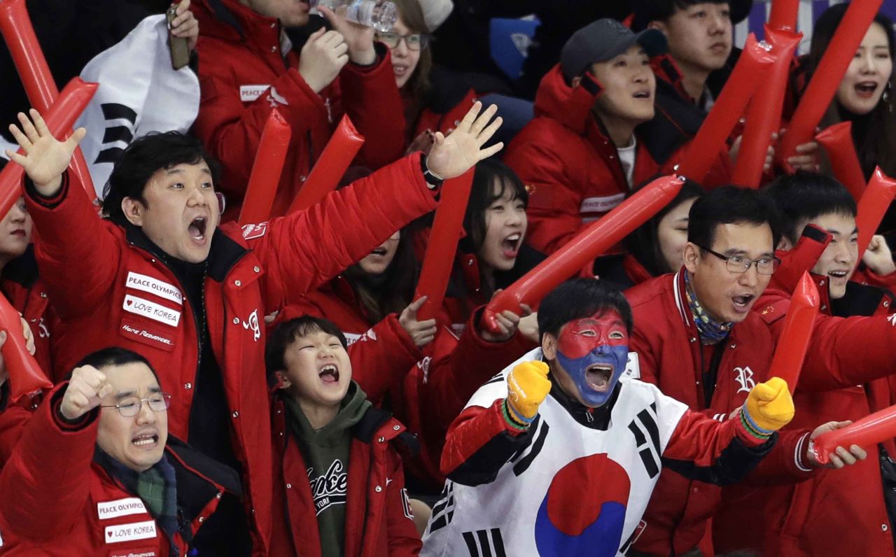 South Koreans cheer on speedskater Lee Seung-hoon during the 10,000 meters. He finished in fourth.