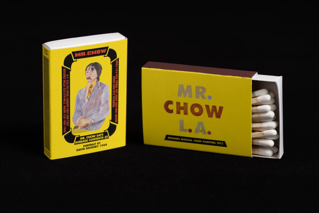 A Mr Chow matchbox from 1984, featuring "Mr Chow Portrait" (1967) by David Hockney, and "Mr. Chow L.A." (1973) by Ed Ruscha