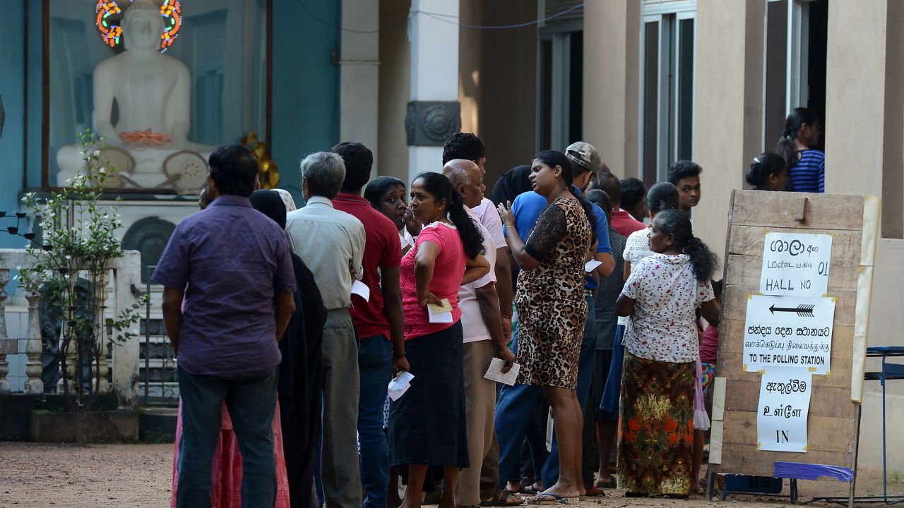 Sri Lankans queue up to cast their vote in the country's local elections at a polling station in Colombo on February 10, 2018.
