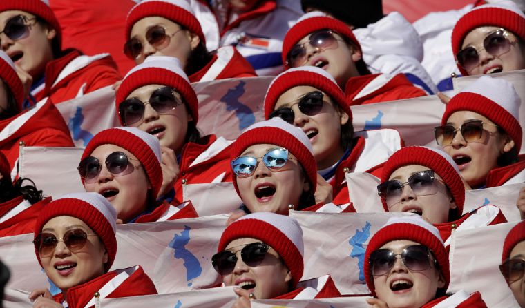 North Korean cheerleaders perform while watching the first run of the women's slalom.