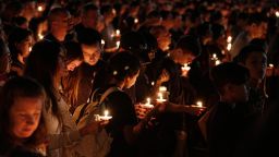 Thousands of mourners attend a candlelight vigil for victims of the Marjory Stoneman Douglas High School shooting in Parkland, Florida on February 15, 2018.A former student, Nikolas Cruz, opened fire at the Florida high school leaving 17 people dead and 15 injured. / AFP PHOTO / RHONA WISERHONA WISE/AFP/Getty Image