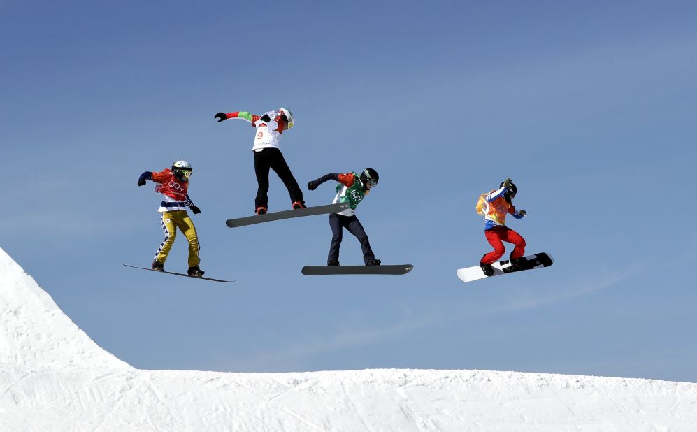 Athletes compete in a snowboard cross semifinal. From left are Eva Samkova of the Czech Republic, Alexandra Jekova of Bulgaria, Lindsey Jacobellis of the United States and Loccoz Nelly Moenne of France.