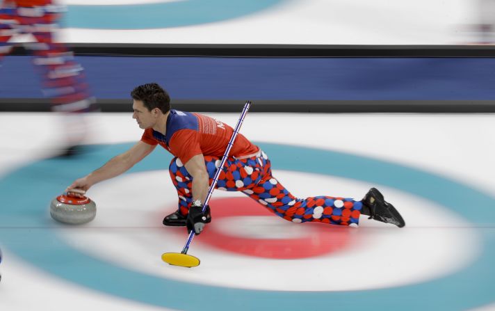 Norwegian skip Thomas Ulsrud throws a stone during a curling match against South Korea.