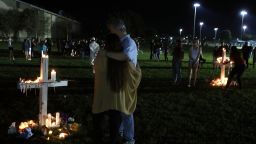 PARKLAND, FL - FEBRUARY 15:  Students, friends, and family members gather around candlit crosses during vigil for victims of the mass shooting at Marjory Stoneman Douglas High School yesterday, at Pine Trail Park, on February 15, 2018 in Parkland, Florida. Yesterday Police arrested 19 year old former student Nikolas Cruz for killing 17 people at the high school.  (Photo by Mark Wilson/Getty Images)
