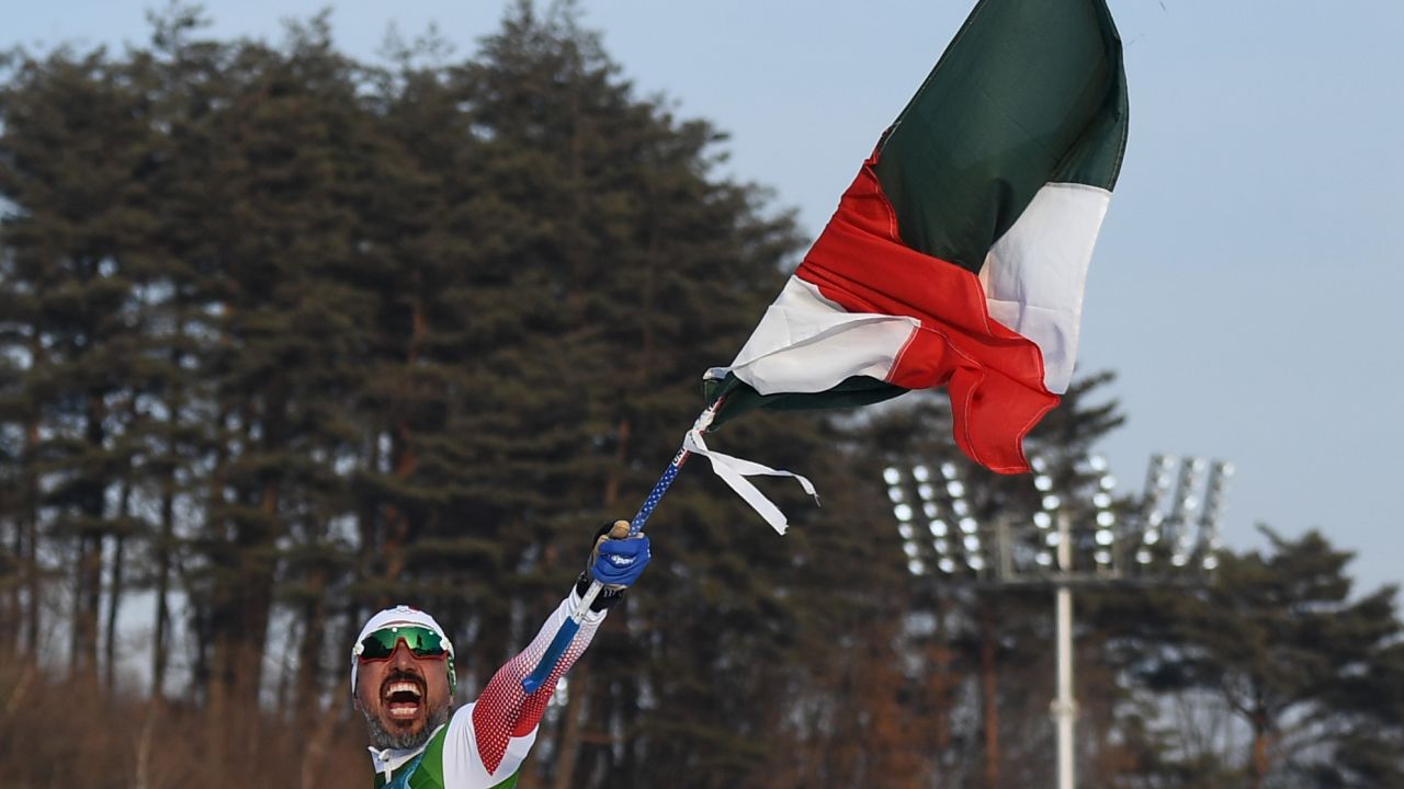German Madrazo holds his flag high.