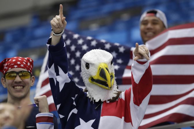 Supporters of Team USA cheer during the men's hockey game against Slovakia.