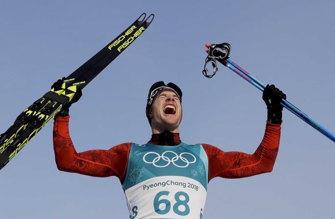 Cross-country skier Dario Cologna, representing Switzerland, celebrates after winning gold in the 15-kilometer freestyle for the third straight Olympics.