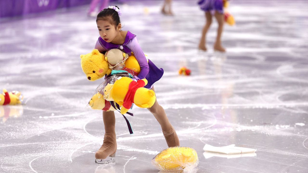 GANGNEUNG, SOUTH KOREA - FEBRUARY 16:  Skaters pick up gifts thrown to the ice for Yuzuru Hanyu of Japan during the Men's Single Skating Short Program at Gangneung Ice Arena on February 16, 2018 in Gangneung, South Korea.  (Photo by Maddie Meyer/Getty Images)