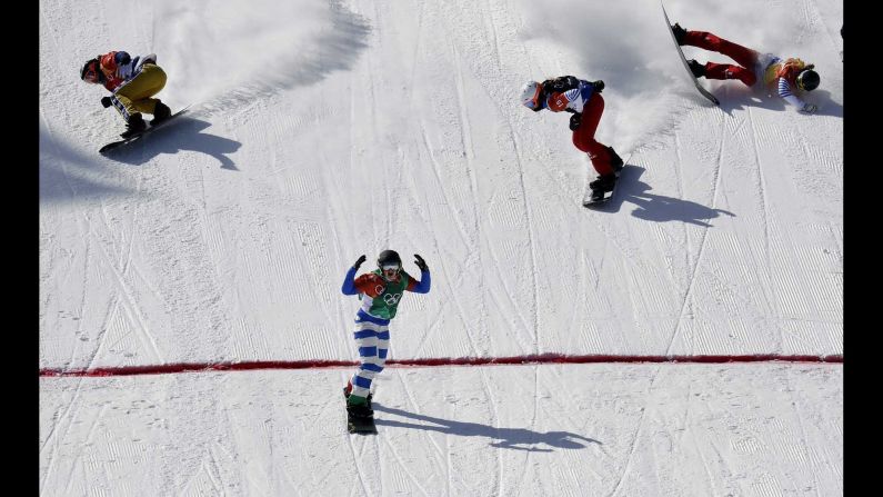 Italy's Michela?Moioli finishes first in the snowboard cross final.