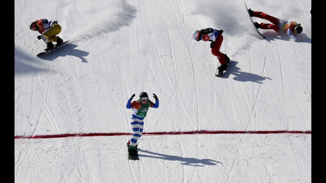 Italy's Michela Moioli finishes first in the snowboard cross final.