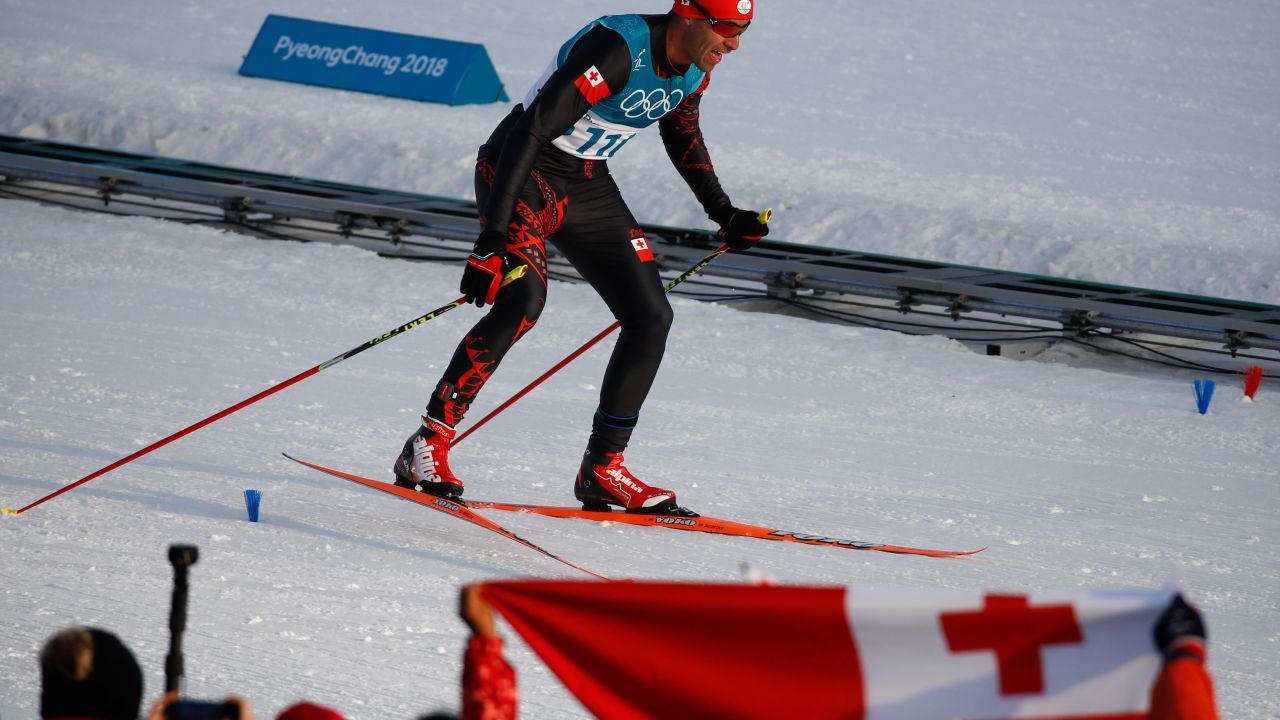 Taufatofua crosses the finish line.