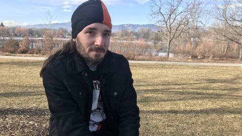 Zach Denton at a memorial for Hoffmann, the mother of his child, in the park where she was killed in Fort Collins, Colorado. 