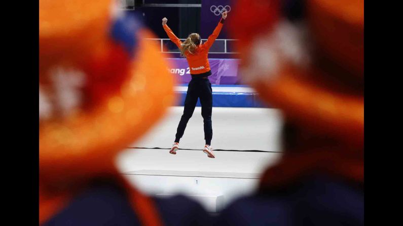 Dutch speedskater Esmee Visser celebrates on the podium after winning gold in the 5,000 meters. It is the Netherlands' sixth gold of these Games -- all in speedskating.