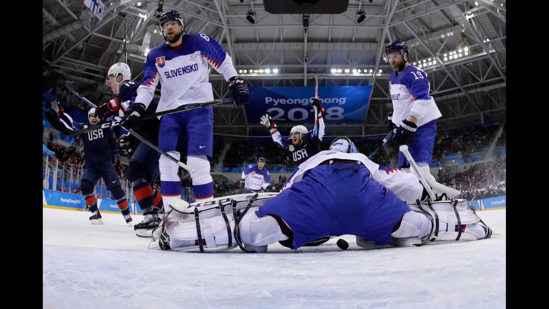 US hockey player Ryan Donato, back center, celebrates one of his two goals against Slovakia. The Americans won 2-1 for their first victory of these Olympics.