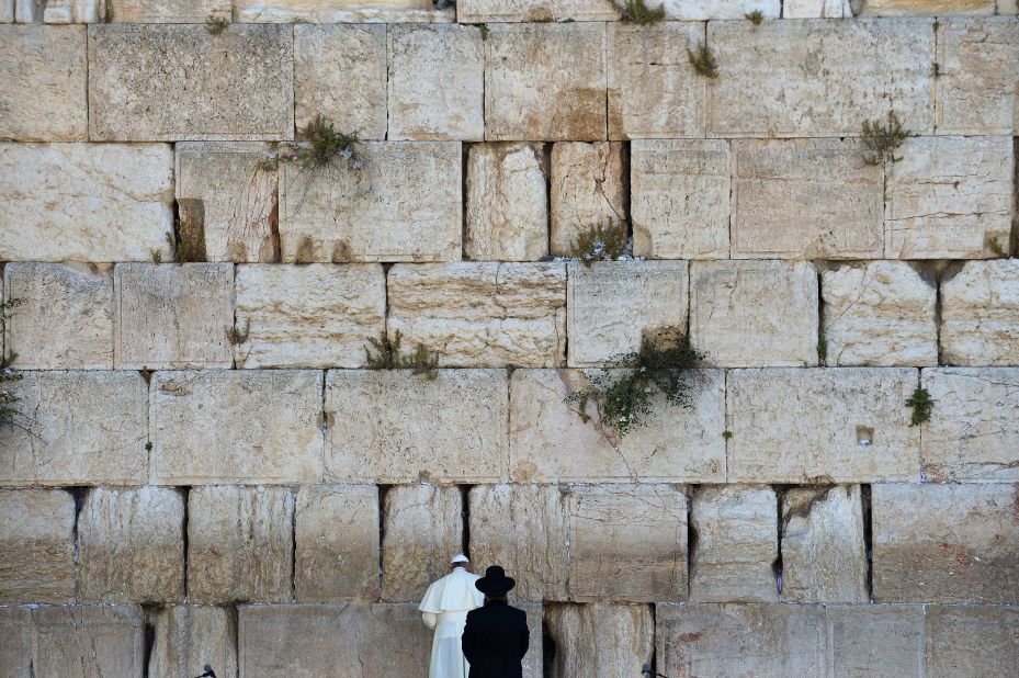 Francis prays next to a rabbi at the Western Wall in Jerusalem's Old City in May 2014. The Pope went on a three-day trip to the Holy Land, and he was accompanied by Jewish and Muslim leaders from his home country of Argentina.